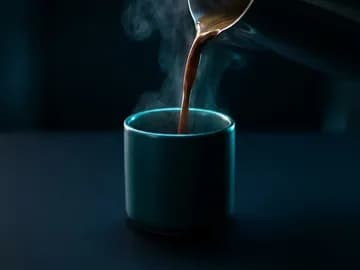 AI-generated b-roll still of coffee poured into a teal CASA cup